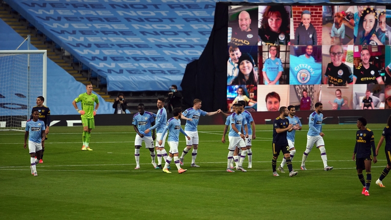 Kevin De Bruyne celebrates scoring Manchester City's second from the penalty spot as fans watch on remotely