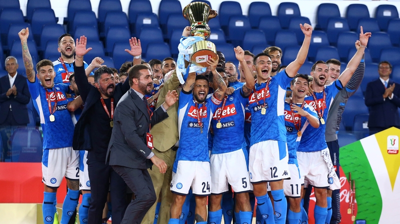 Napoli players celebrate with the trophy
