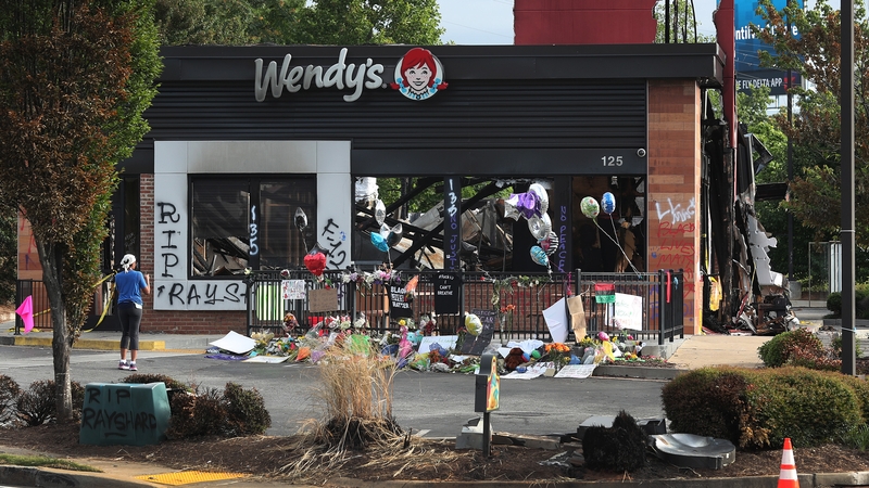 People visit the Wendy's restaurant outside which Rayshard Brooks was shot dead