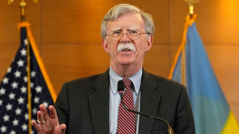 John Bolton is charged with sharing top secret documents by email with two 'unauthorised individuals'