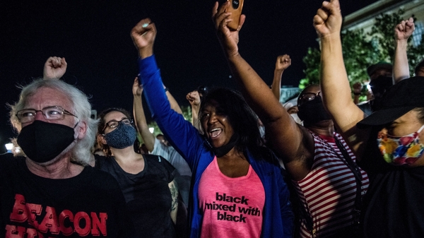 Crowds cheer last night as a Confederate monument is removed in Atlanta ahead of Juneteenth commemorations
