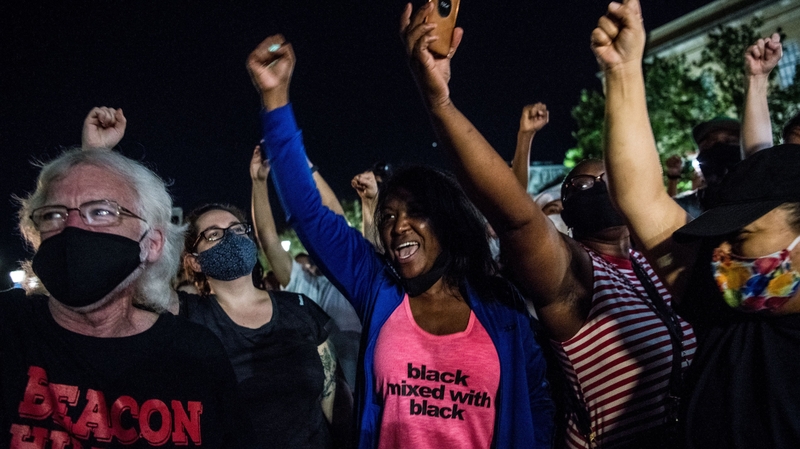 Crowds cheer last night as a Confederate monument is removed in Atlanta ahead of Juneteenth commemorations