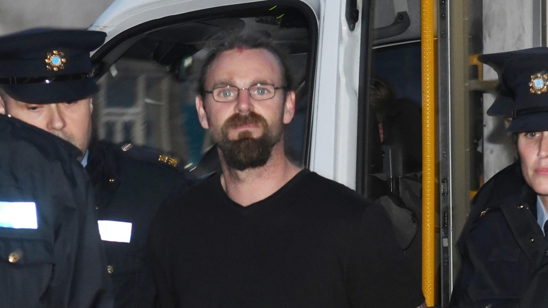 Stephen Silver arriving in court accompanied by gardaí