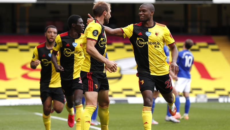 Christian Kabasele celebrates with goalscorer Craig Dawson who hit a bicycle kick in injury-time