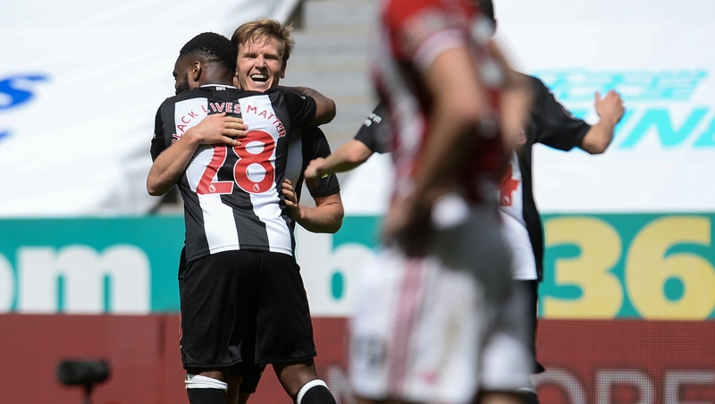 Matt Richie celebrates his strike with Danny Rose