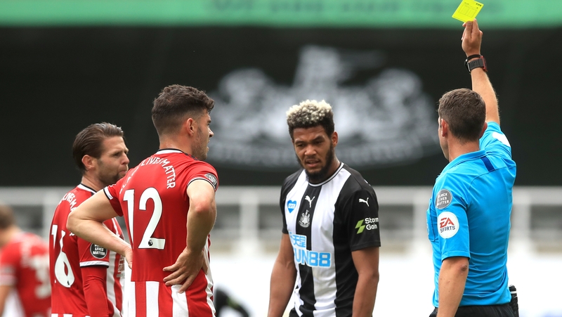 John Egan and Joelinton were both booked by referee David Coote in the incident