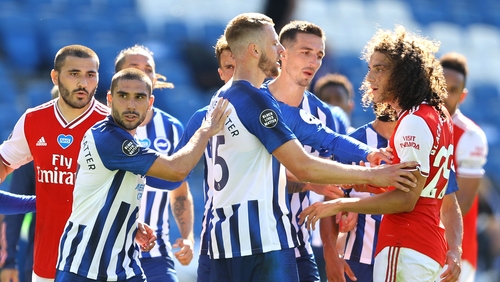 Matteo Guendouzi (r) confronts Neal Maupay (l)