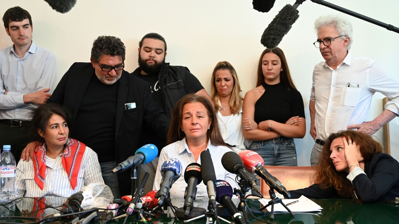 Fatima Chouviat, the mother of Cedric Chouviat, surrounded by family as they appeal for answers