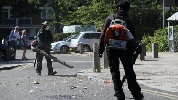 Volunteers clean up following the disturbances in Brixton