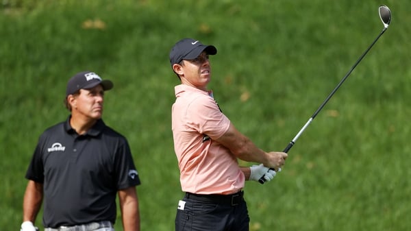 Rory McIlroy and Phil Mickelson out on course on day one