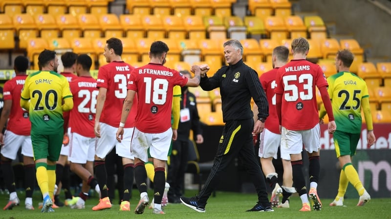 Manchester United manager Ole Gunnar Solskjaer congratulates Bruno Fernandes (18) after the win over Norwich