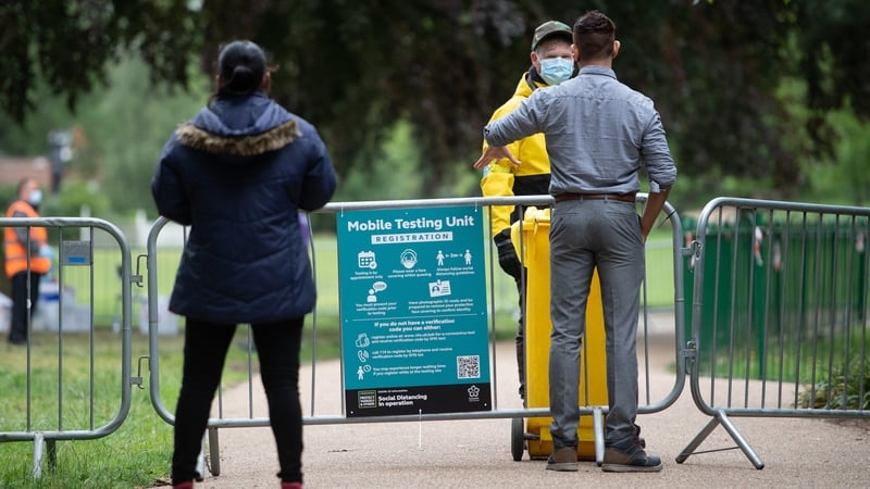 People queue at a walk-in mobile Covid-19 testing centre at Spinney Hill Park in Leicester