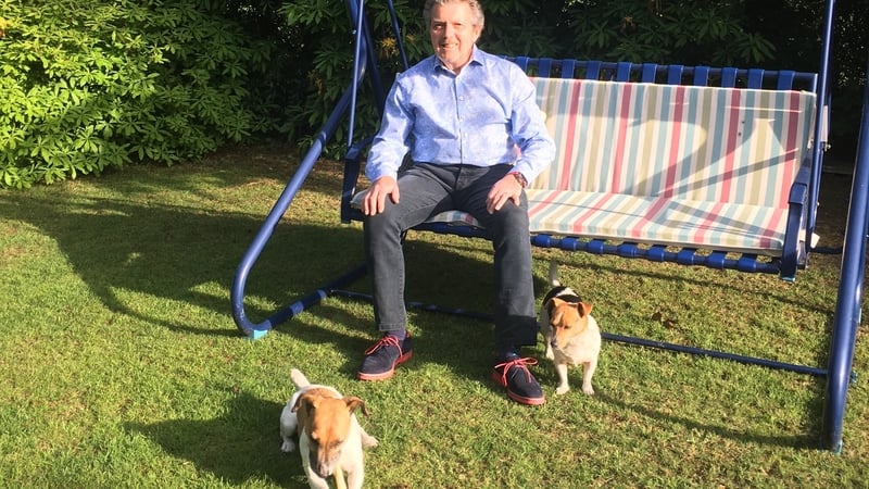 George Hamilton, RTÉ Sport and lyric FM, relaxing in the garden with his two Jack Russells, Brenda and Eddie.