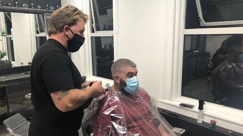 Choppers Owner and head barber Ben Condron cutting customer Daragh's hair