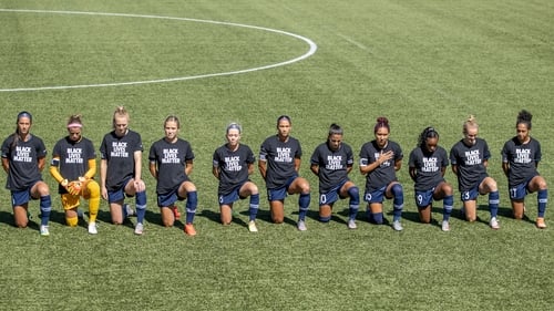 North Carolina Courage players take a knee
