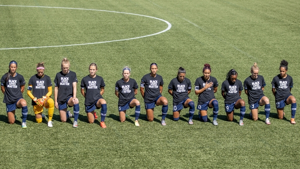 North Carolina Courage players take a knee