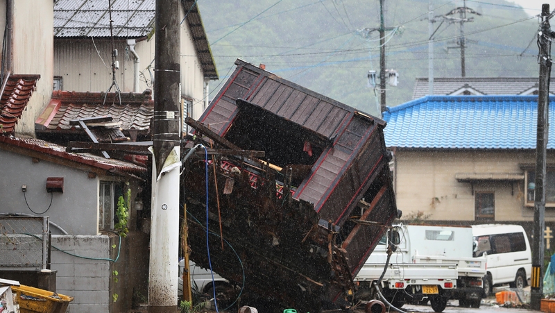 A collapsed house lies on a street in Hitoyoshi, Kumamoto prefecture