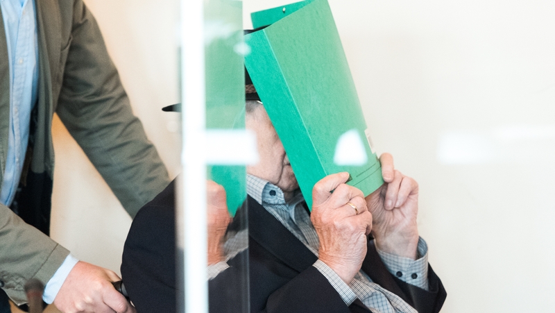 Bruno Day hides his face as he is brought into court in May
