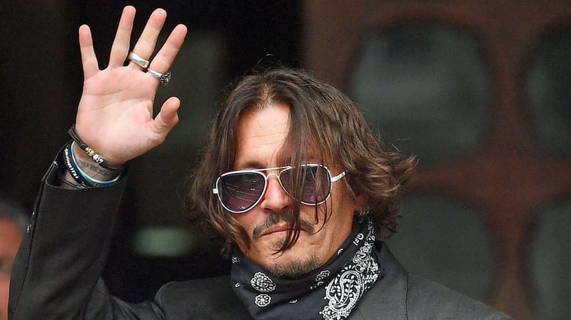 Johnny Depp, pictured arriving at London's High Court today, denies attacking ex-wife Amber Heard