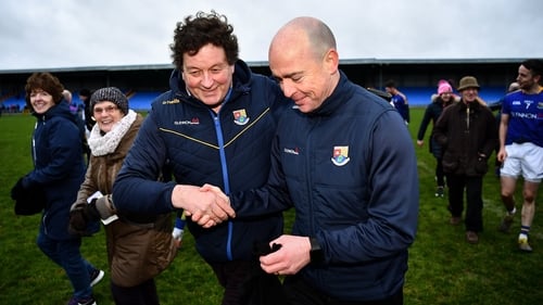 Longford chairman Albert Cooney congratulates manager Padraic Davis after the O'Byrne Cup semi-final win over Dublin in January
