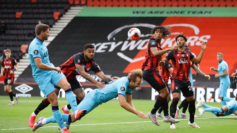 Harry Kane is challenged by Joshua King