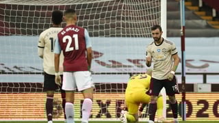 Fernandes celebrates after scoring his penalty to open the scoring