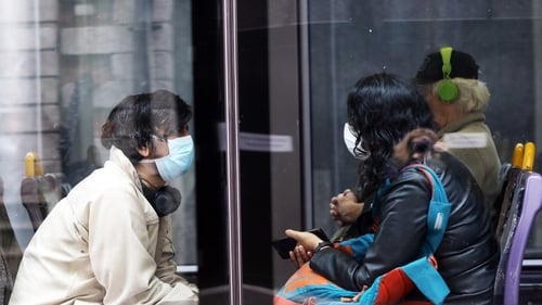 Luas passengers pictured wearing face coverings, which will be compulsory on public transport from Monday (file pic)