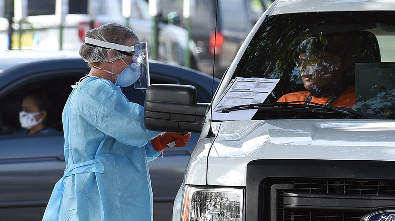 A patient is tested at a drive-in centre in Florida
