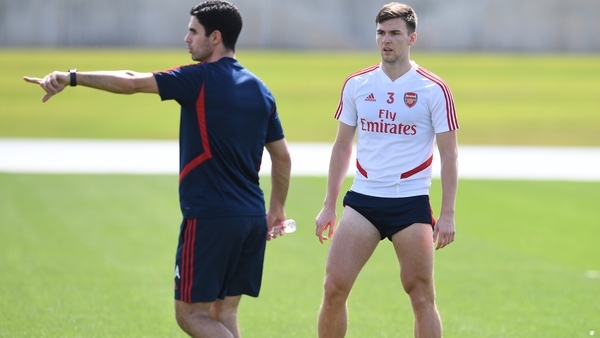 Mikel Arteta (L) and Kieran Tierney on the training ground