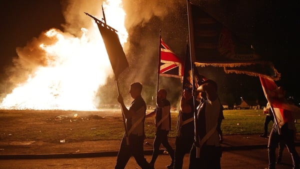 A loyalist band marches around the Ballycraigy estate during in Antrim last night
