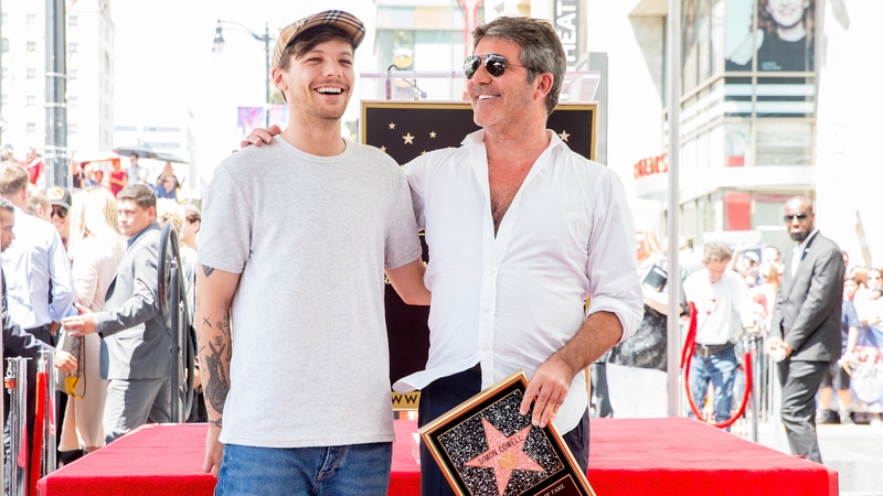Louis Tomlinson and Simon Cowell