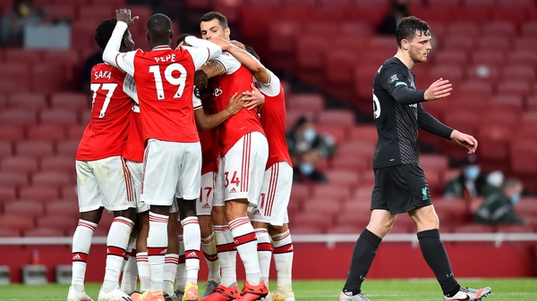 Arsenal players celebrate making it 2-1 against Liverpool