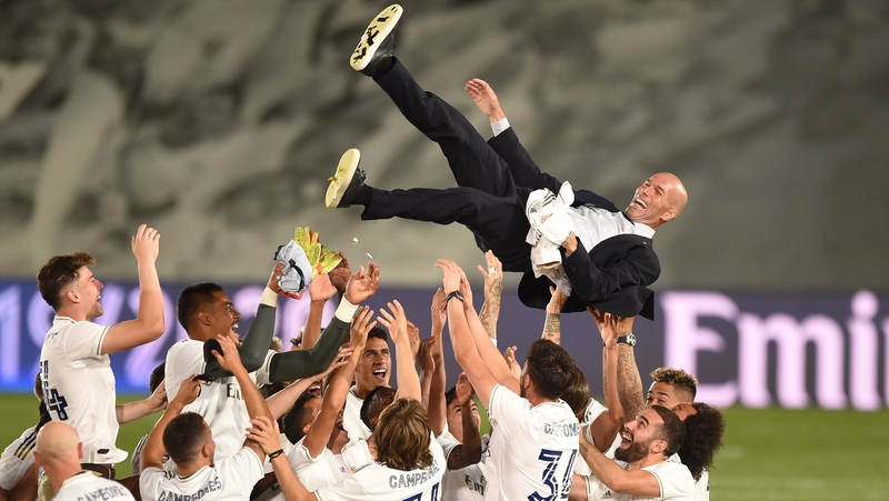 Real Madrid head coach Zinedine Zidane is thrown up in the air by his players after being crowned league champions