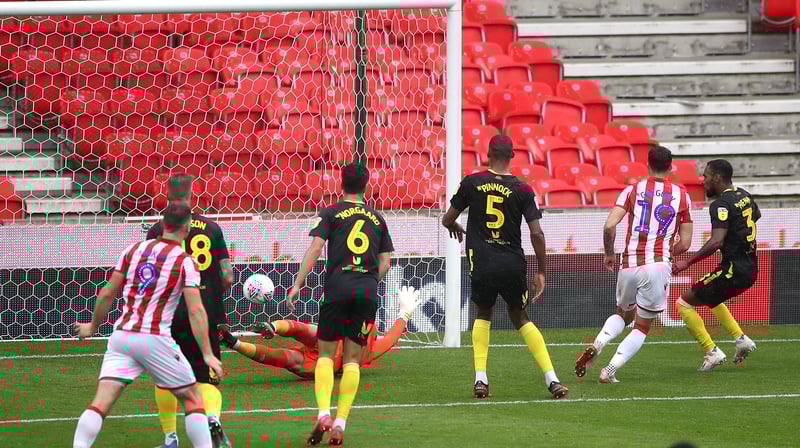 Stoke City's Lee Gregory (second right) scores v Brentford