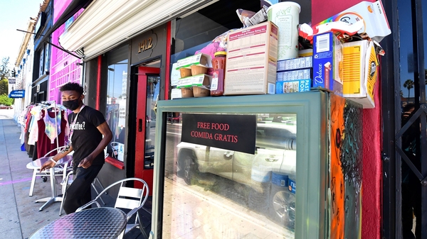 Solo Morris steps out of the Little Amsterdam Coffee shop in Los Angeles to re-stock the frosted-glass fridge