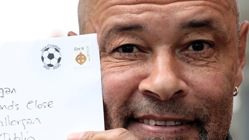 Former Republic of Ireland international Paul McGrath exhibits a letter with the Jack Charlton postmark