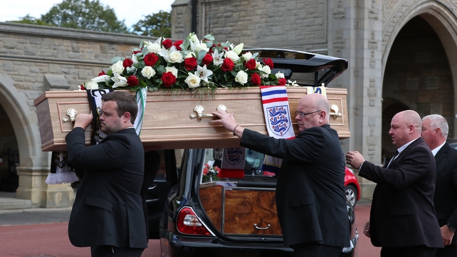 Charlton's coffin being carried into the chapel