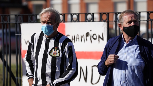 Masked locals wait to salute Charlton - The former Ireland boss managed both Middlesbrough and Newcastle before jumping across the Irish Sea