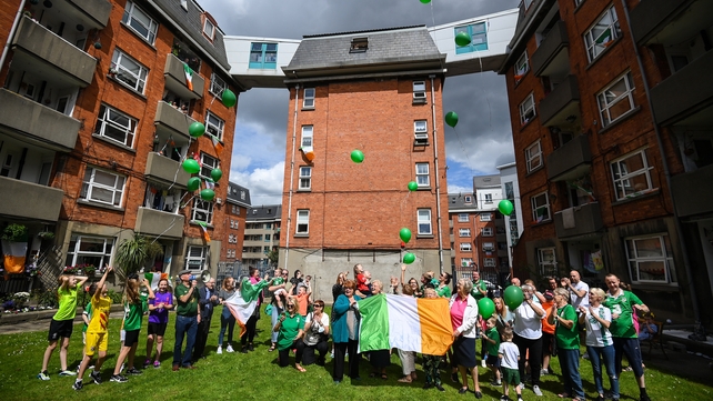 Residents of the Iveagh Trust in Kevin Street, Dublin, release balloons honouring Jack Charlton