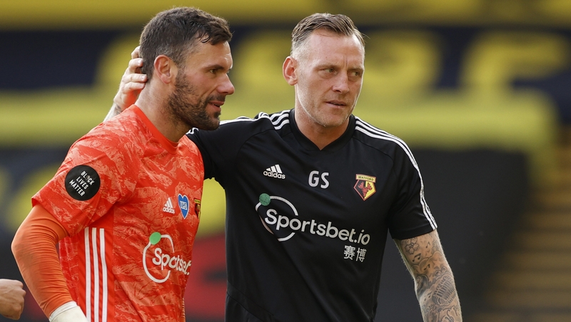 Ben Foster (L) is consoled by Graham Stack after the loss to Manchester City
