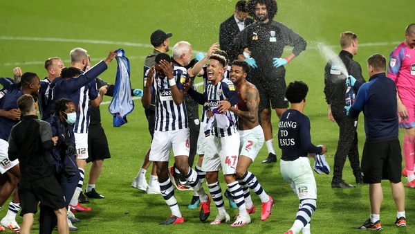 Goalscorer Callum Robinson (47) and his West Brom team-mates celebrate promotion