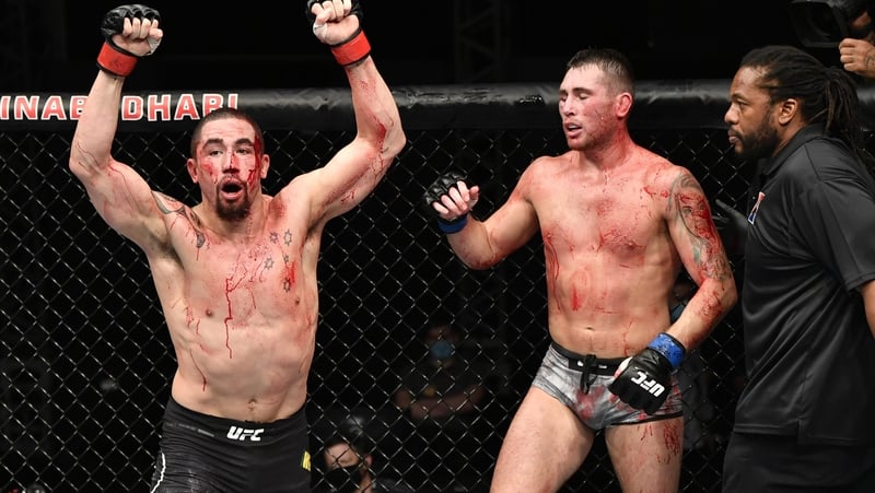 Rob Whittaker raises his hands following the gruelling encounter with Liverpudlian Till