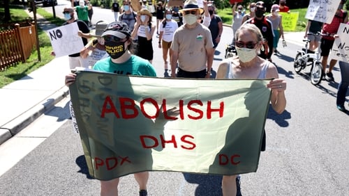 Protesters marching today on the home of Secretary of Homeland Security Chad Wolf in Alexandria, Virginia