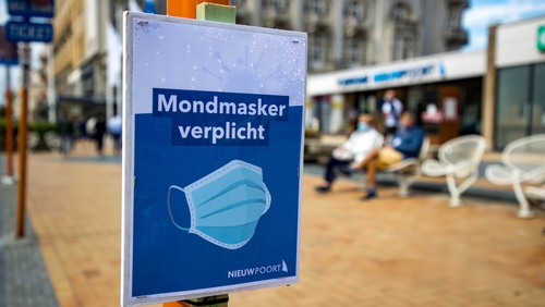 A sign reminds people in the Belgian coastal town of Nieuwpoort to wear face masks