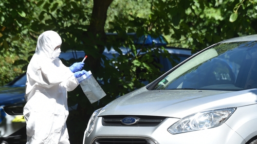A health worker carries out a Covid-19 test at a testing station for residents in Mamming, Germany