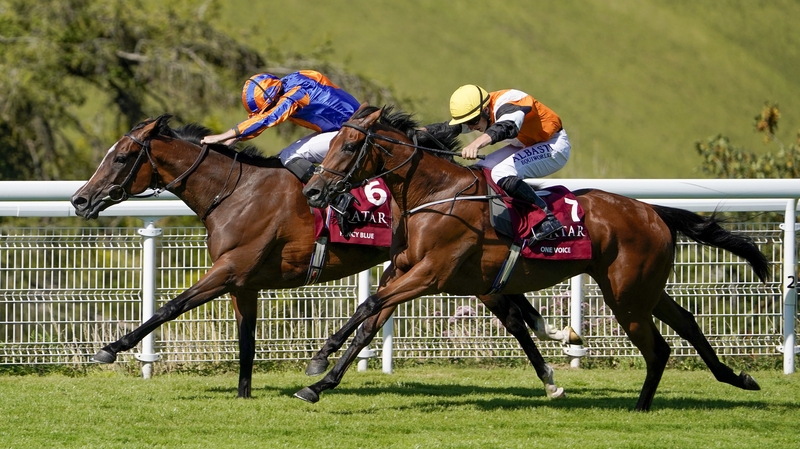 With the rail to help her, Fancy Blue repelled the challenge of One Voice