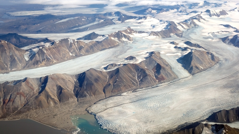 Melting glaciers during a summer heat wave located far north of the Arctic Circle