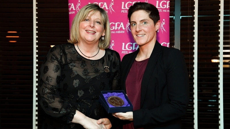 Diane O'Hora being presented with her coaching medallion by LGFA President Marie Hickey during the Learn to Lead – LGFA Female Leadership Programme graduation evening