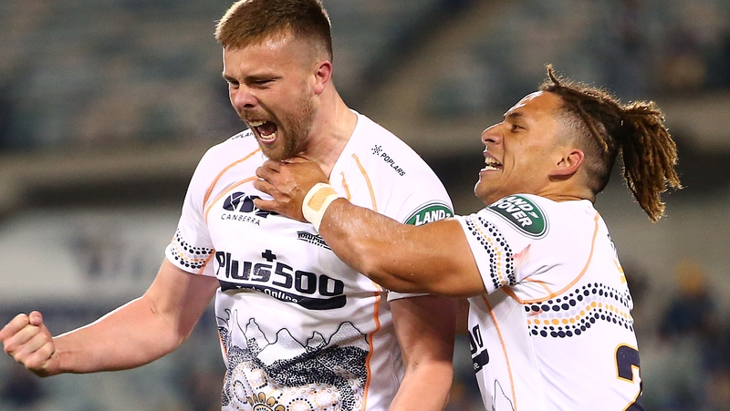 Mack Hansen (left) is congratulated after kicking a late winner