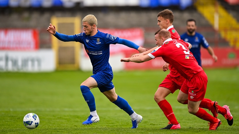 Alistair Coote of Waterford in action against Lorcan Fitzgerald and Brian McManus of Shelbourne